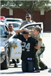 Deputies Arresting Youth in Football Jersey