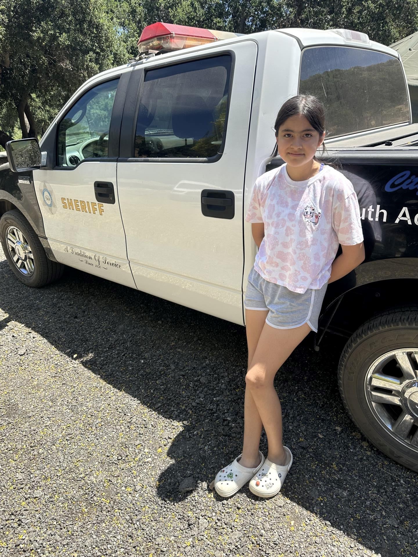 Girl Next to Sheriff Car (JPEG)